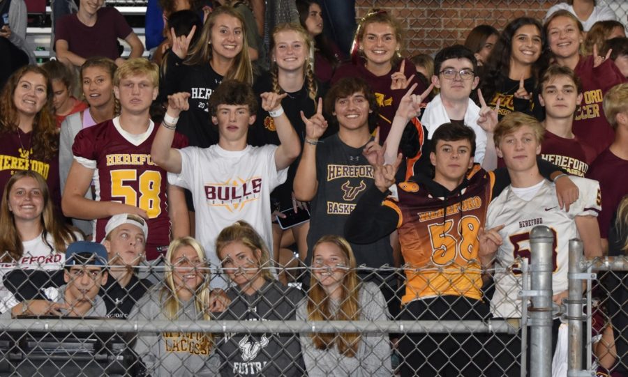 Hereford+fans+show+their+pride+with+the+%E2%80%9Cbulls+up%E2%80%9D+symbol.+Hereford%E2%80%99s+students+section+cheered+on+the+Bulls+football+team+against+Milford+Mill.