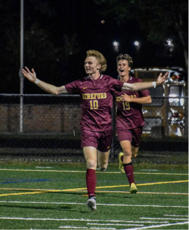 Logan Sinsebox (22) and Grayson Hammann (22) celebrate after a goal scored by Sinsebox in the second half. 