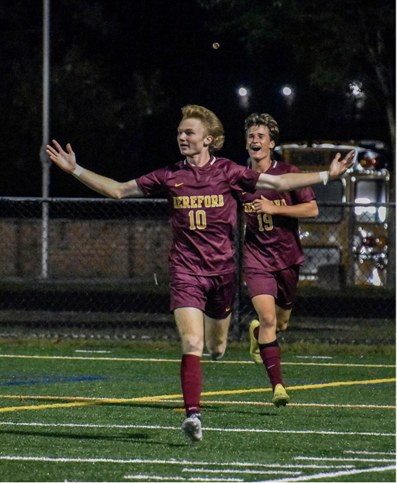 Logan Sinsebox ('22) and Grayson Hammann ('22) celebrate after a goal scored by Sinsebox in the second half. 