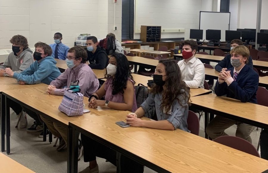 Xander van Dorpe (’23), John Venn (’23), Emerson Lehnert (’22), Harshini Arumugam (’22), Emma Perez (’22), (second row) Jordan Freeman (‘23), Aidan Sabo (’23), Zach Jacobs (’22), Parker Knight (’22), and Brendan Keller (’22) listen to Mr. Schreiner (not pictured) explain the agenda for the meeting. FBLA’s members made sure to wear their masks even after school hours. 