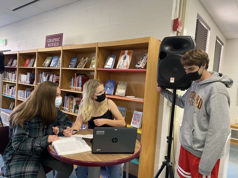 Katie Lowe (22), Taylor Brinsfield (22), and Alex Bierly (22) discuss developments in their research. The trio completed AP seminar in just 14 weeks last year, and are excited to see what develops from a full year of research.