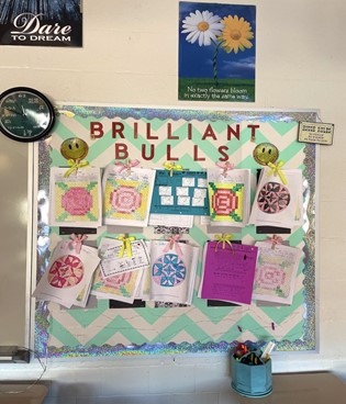 A pin board hung up in Amanda Coburns classroom. A place Coburn uses to hang up students hard work.  