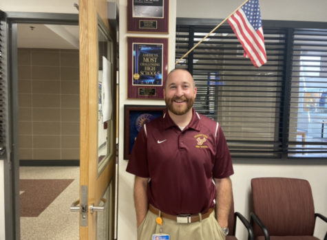 Principal Covert proudly shows off Herefords many awards.