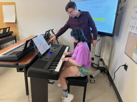 Mr. Pilius evaluates Ella Schmier (25) ability of playing the piano during Music Tech Class. 