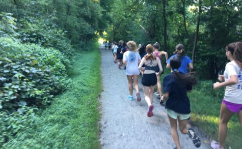 Hereford girl's XC team runs on the NCR trail at a summer practice. The trail's flat surface helped the runners focus on pace for the upcoming season. 